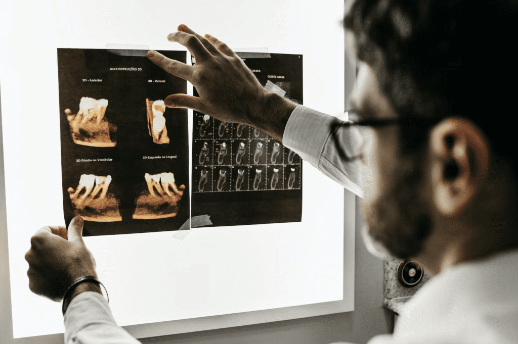 oral surgeon reviewing scans